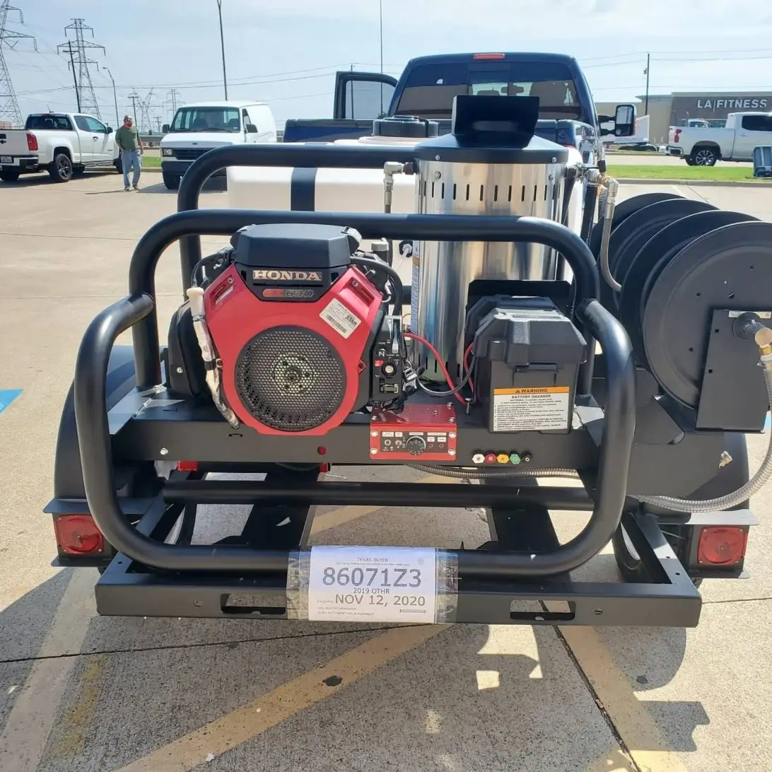 Hot-water pressure washer trailer with a Honda engine and hose reels.
