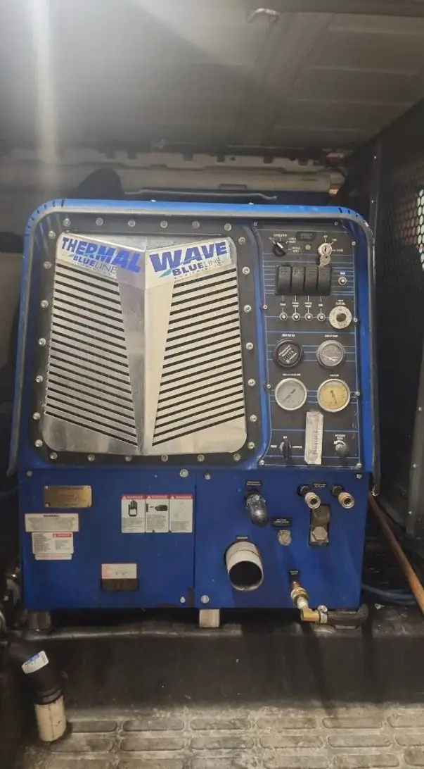 Blue Thermal Wave truck-mounted extraction unit inside the work van.